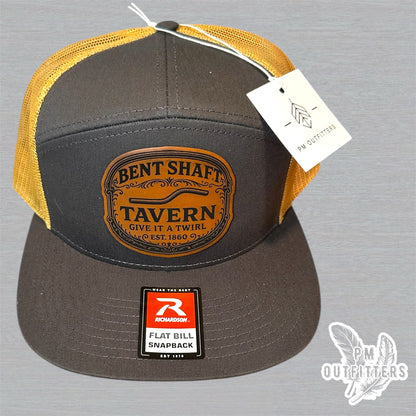 Bent Shaft Tavern Trucker Hat - Custom Leatherette Patch Richardson 168 | Grey Gold Flat Bill Humor Cap