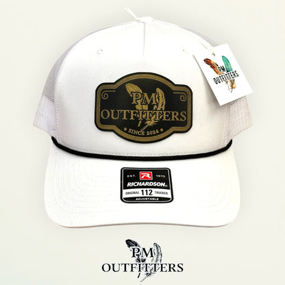 PM Outfitters logo patch detail black gold crossed feathers Since 2024