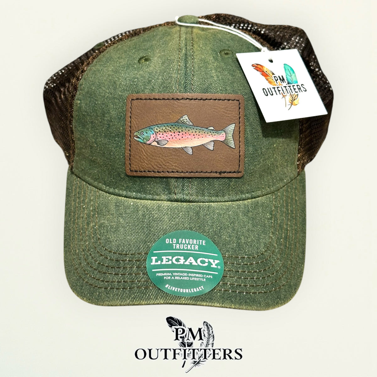 Hand-painted rainbow trout patch on an olive Legacy Old Favorite trucker hat with bronze mesh back, PM Outfitters True Originals