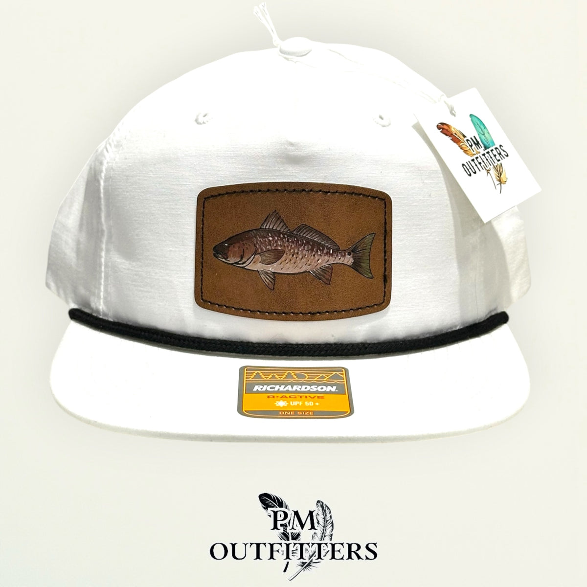 Side view of the hand-painted redfish patch on the white Richardson 256 rope cap, PM Outfitters True Originals