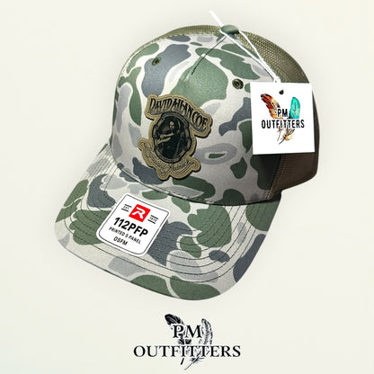 PM Outfitters hang tag David Allan Coe camo trucker hat