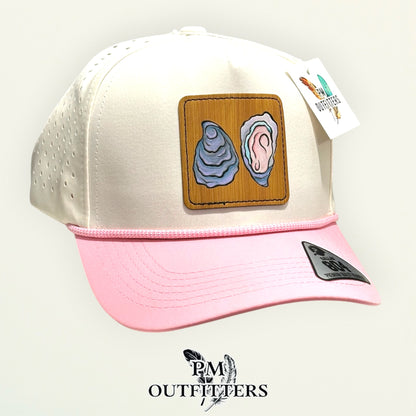Hand-painted Gulf oyster patch on a cream and pink Dallas 804 waterproof rope trucker hat, PM Outfitters True Originals