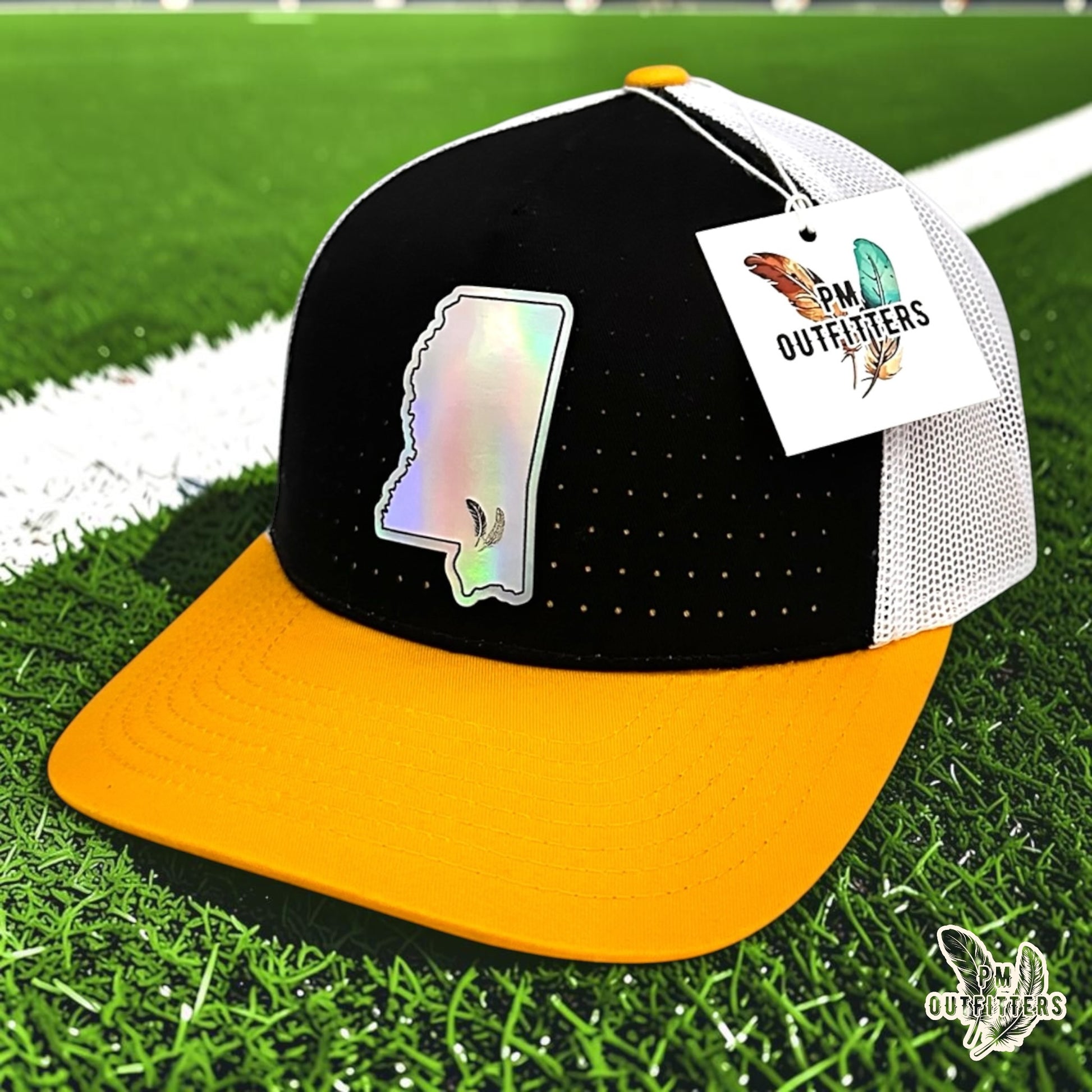 PM Outfitters Southern Miss Tailgate Season holographic vegan leather Mississippi state outline patch trucker hat Hattiesburg two-feather logo black gold