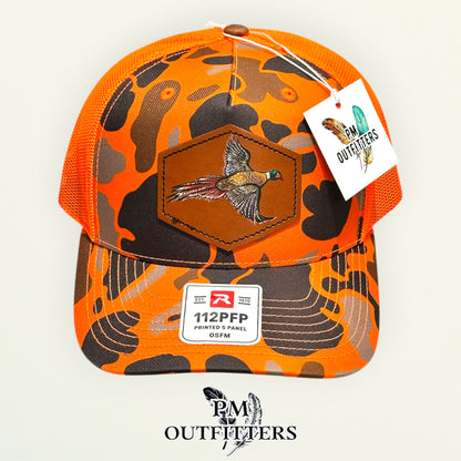 Hand-painted Pheasant patch on a blaze duck camo Richardson 112PFP trucker hat, PM Outfitters True Originals