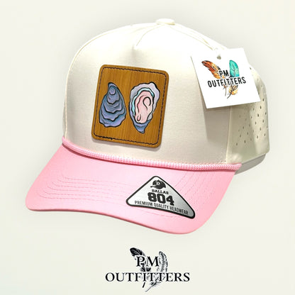 Hand-painted Gulf oyster patch on a cream and pink Dallas 804 waterproof rope trucker hat, PM Outfitters True Originals