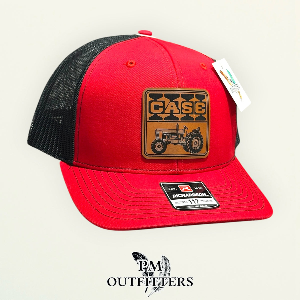 Case trucker hat profile view red front black mesh