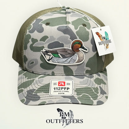 Close-up of the hand-painted Green-Winged Teal patch showing brushwork detail, PM Outfitters True Originals
