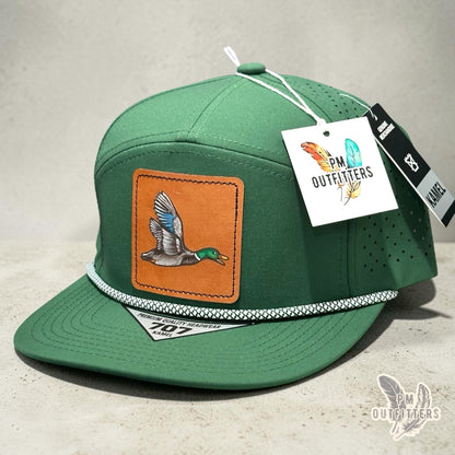 Hand-painted mallard duck patch on a green Kamel 707 performance rope cap, PM Outfitters True Originals