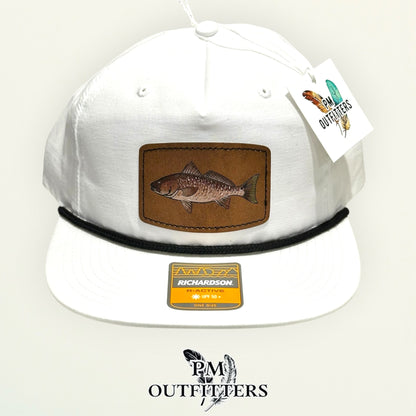 Close-up of the hand-painted redfish patch showing the black tail spot and brushwork detail, PM Outfitters True Originals