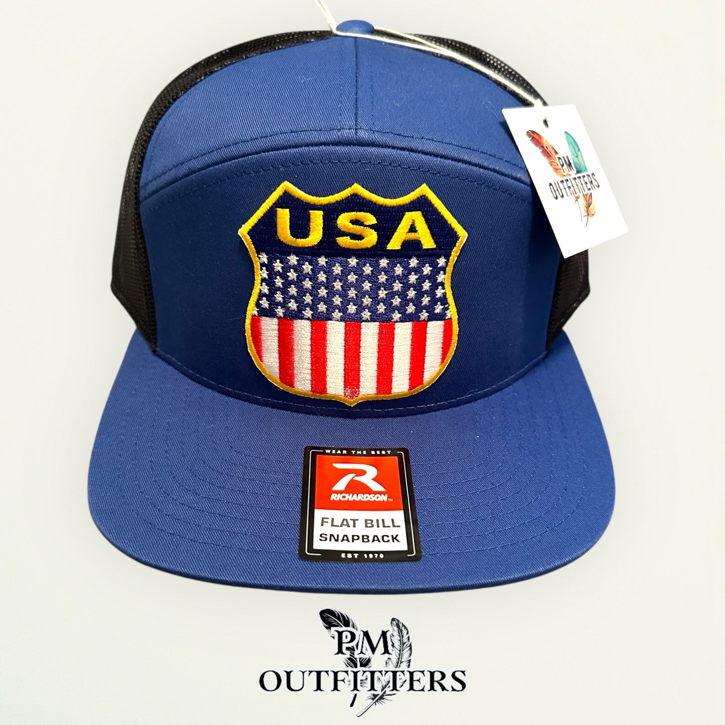 USA Shield Patch Trucker Hat — Retro American Flag Embroidered Patch | Richardson 168 7-Panel Flat Bill Blue Black