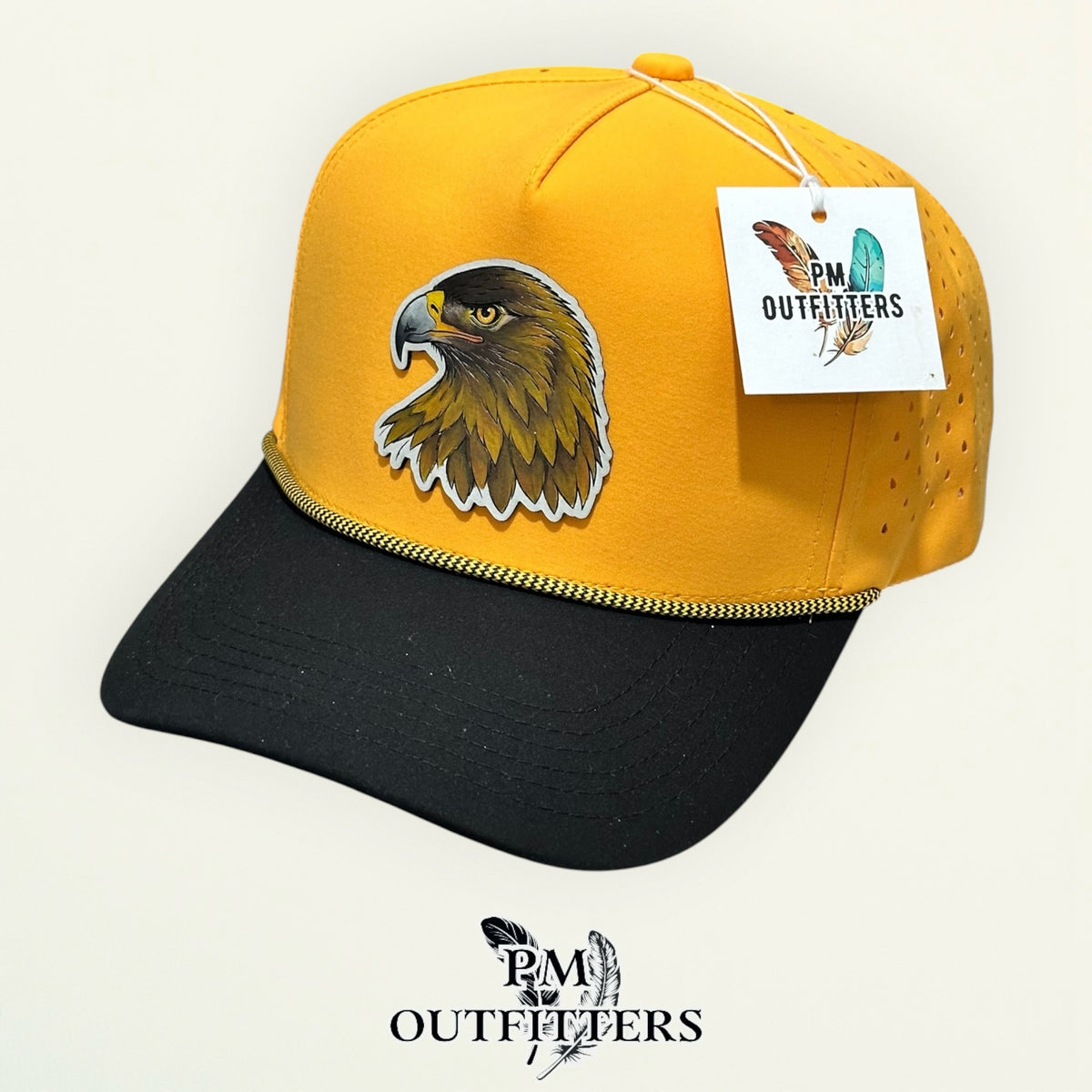 Hand-painted Southern Miss Golden Eagle performance rope cap displayed with PM Outfitters branded hang tag