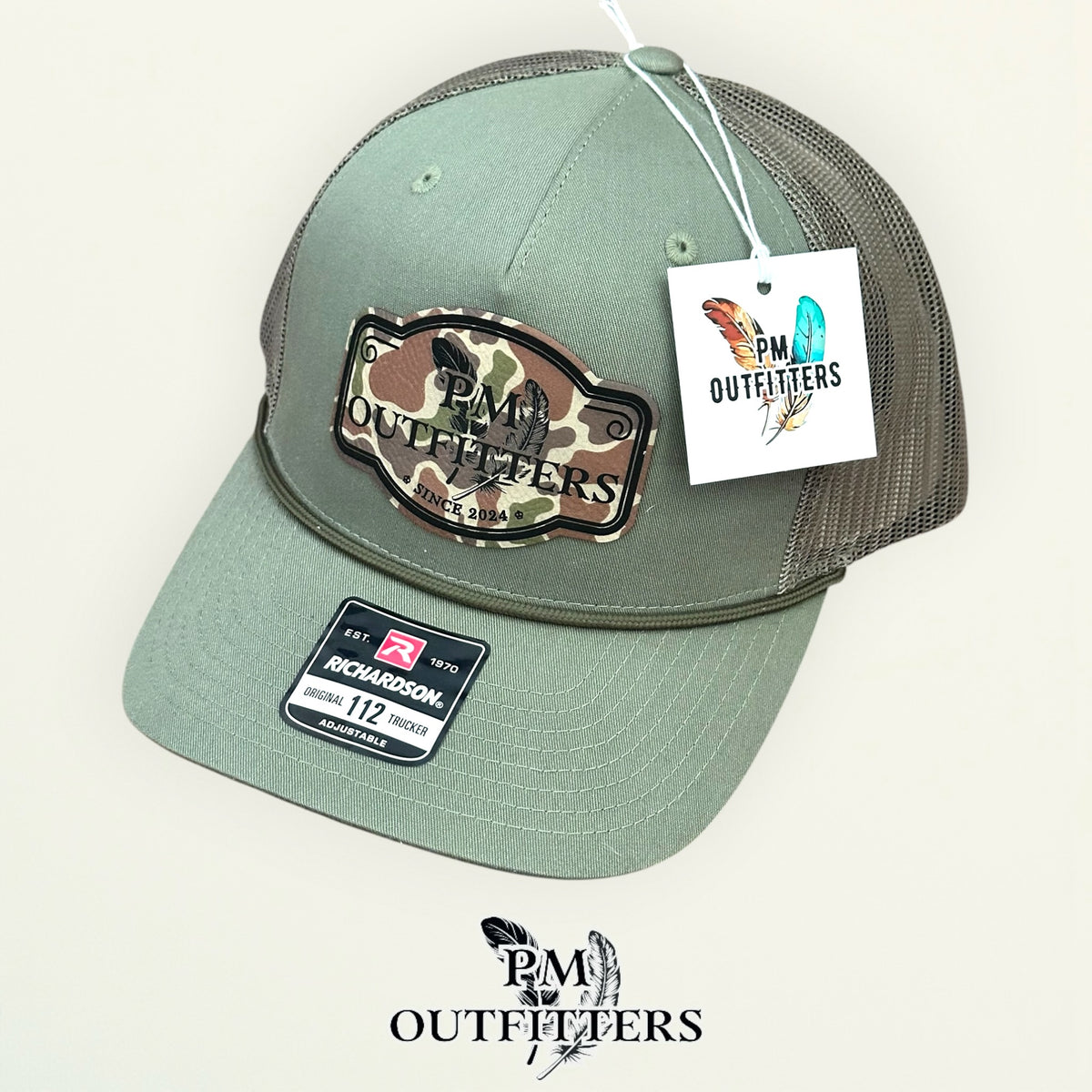 PM Outfitters hang tag loden green rope trucker hat