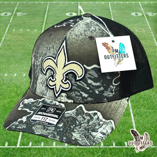 PM Outfitters New Orleans Saints fleur-de-lis embroidered patch Richardson 112 Realtree Excape camo trucker hat