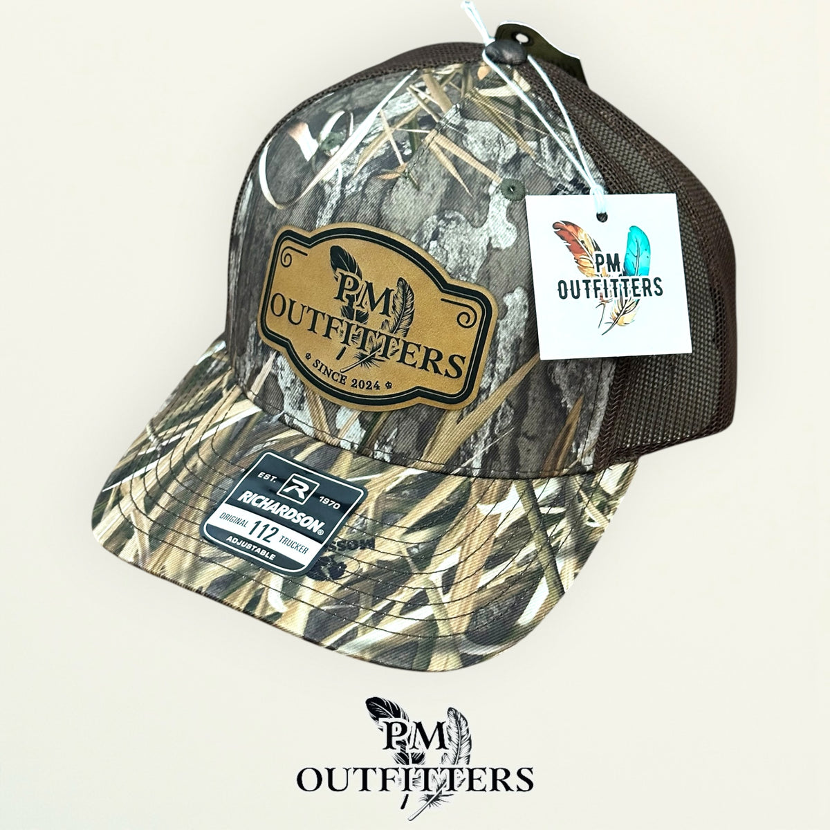 PM Outfitters hang tag Mossy Oak Habitat camo trucker hat