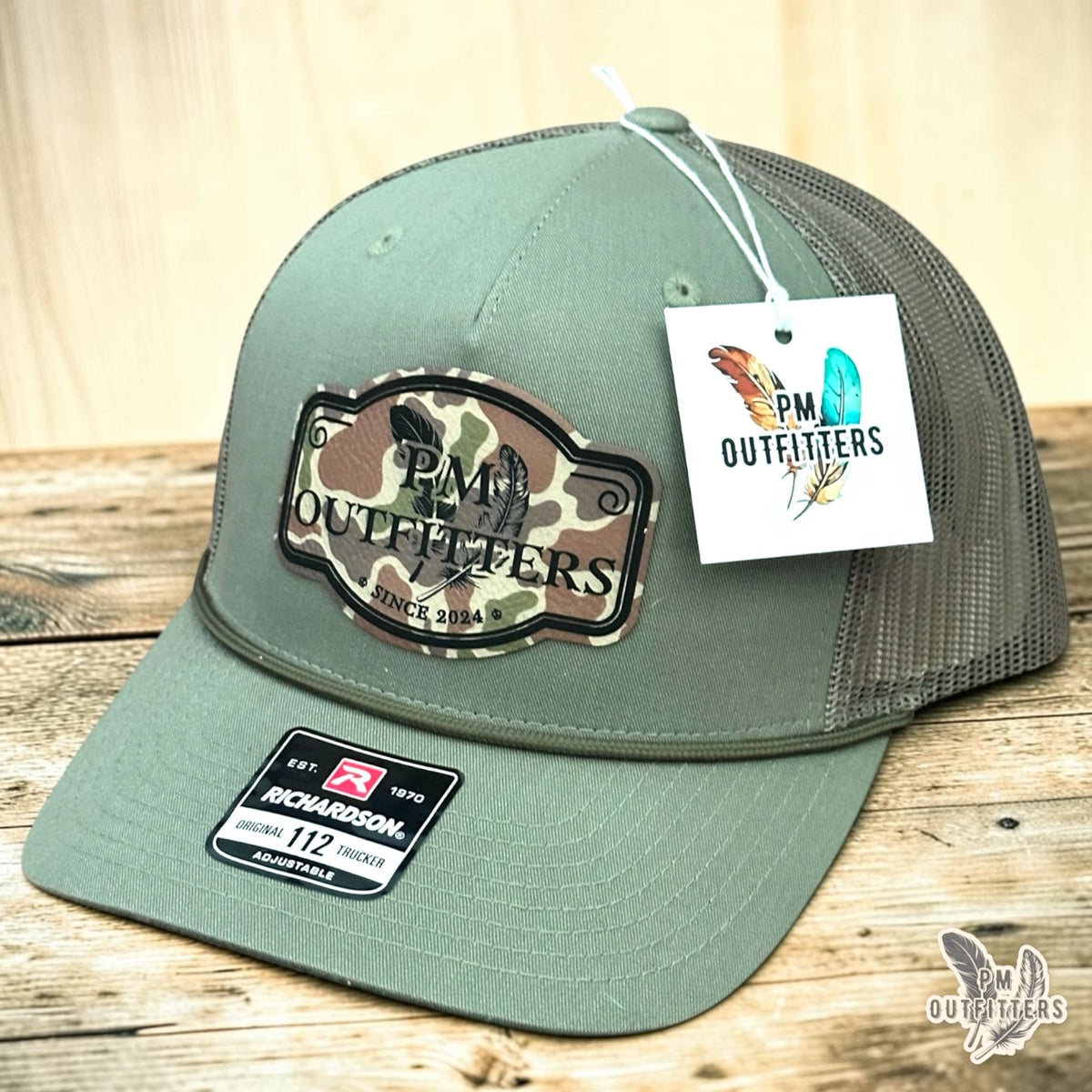 PM Outfitters signature logo rope trucker hat loden green Richardson 112 camo vegan leather patch