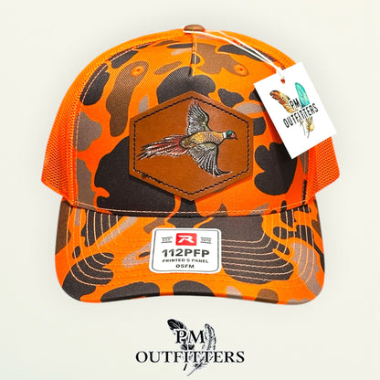 Hand-painted Pheasant patch on a blaze duck camo Richardson 112PFP trucker hat, PM Outfitters True Originals