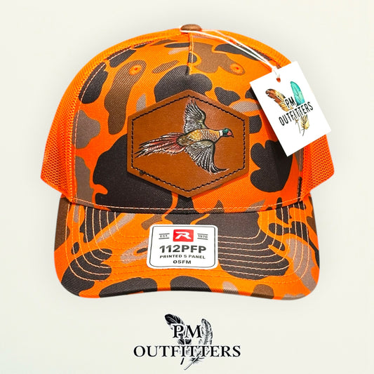 Hand-painted Pheasant patch on a blaze duck camo Richardson 112PFP trucker hat, PM Outfitters True Originals