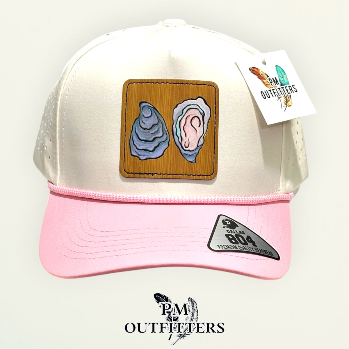Hand-painted Gulf oyster patch on a cream and pink Dallas 804 waterproof rope trucker hat, PM Outfitters True Originals