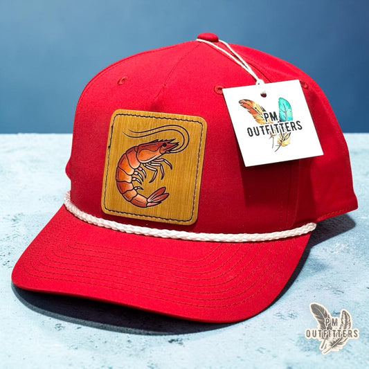 Hand-painted Gulf shrimp patch on a red Richardson 258 rope trucker hat with white trim, PM Outfitters True Originals