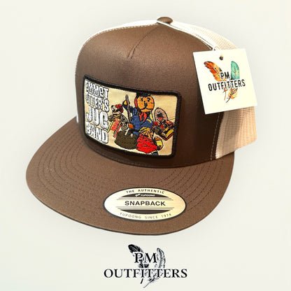 Emmet Otter's Jug Band Trucker Hat — PM Outfitters Retro Patch | Yupoong Flat Bill Brown White Jim Henson Heritage