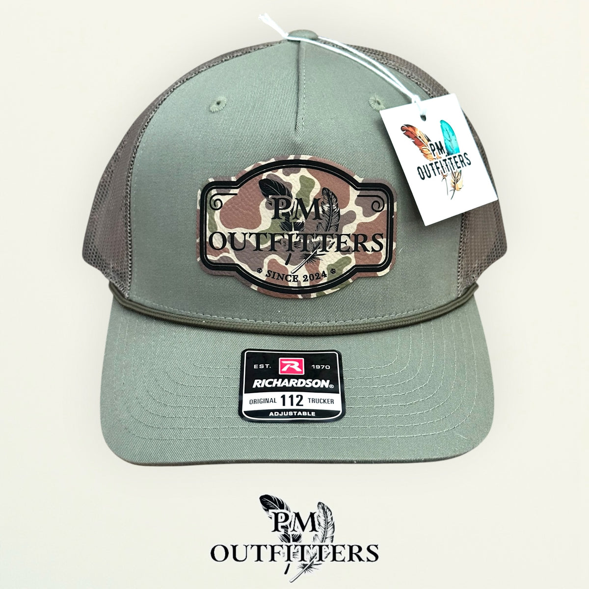 PM Outfitters logo patch detail camo print crossed feathers Since 2024