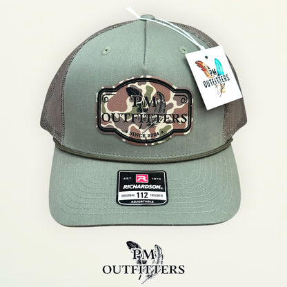 PM Outfitters logo patch detail camo print crossed feathers Since 2024