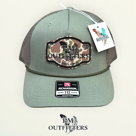 PM Outfitters logo patch detail camo print crossed feathers Since 2024