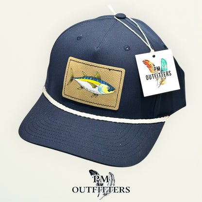 Hand-painted yellowfin tuna performance rope cap displayed with PM Outfitters branded hang tag