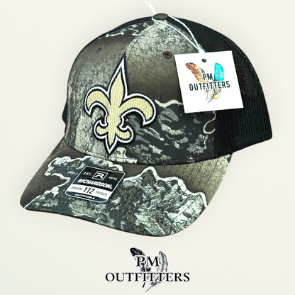 PM Outfitters New Orleans Saints fleur-de-lis embroidered patch Richardson 112 Realtree Excape camo trucker hat