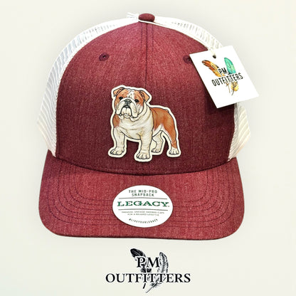 Hand-painted full-body English Bulldog on a cream vegan leather patch, maroon and white Legacy trucker hat, PM Outfitters True Originals