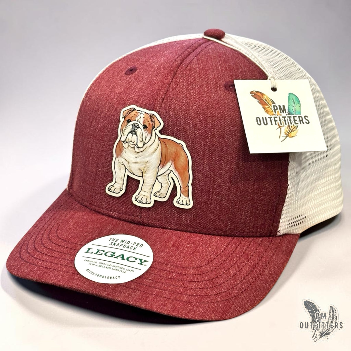 Hand-painted English Bulldog patch, Mississippi State theme, on a Legacy Mid-Pro Snapback trucker hat in heathered maroon and white, PM Outfitters True Originals