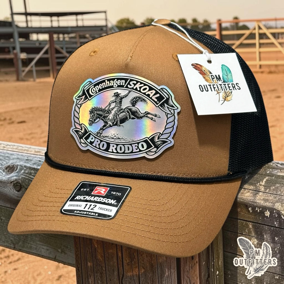 PM Outfitters Copenhagen Skoal Pro Rodeo trucker hat caramel black Richardson 112 rope holographic saddle bronc patch