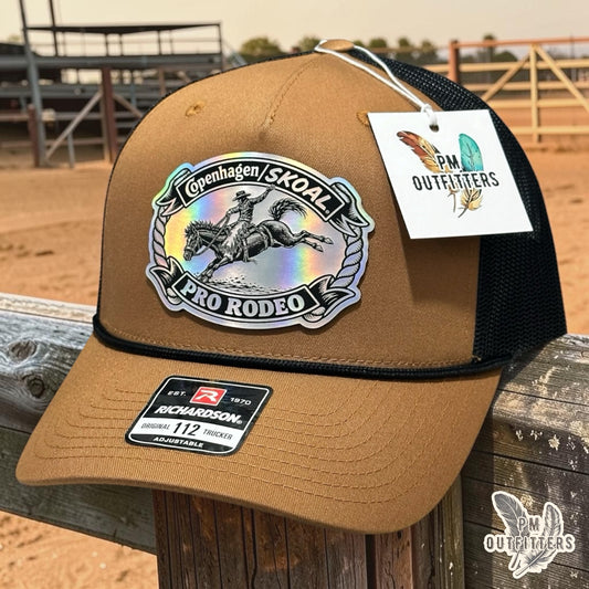 PM Outfitters Copenhagen Skoal Pro Rodeo trucker hat caramel black Richardson 112 rope holographic saddle bronc patch