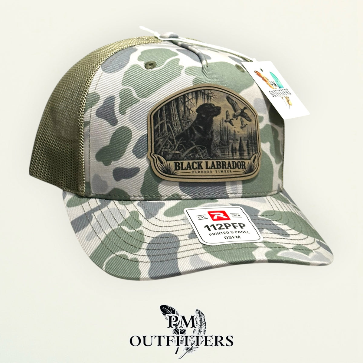Black Labrador flooded timber camo trucker hat – left angle showing mesh back