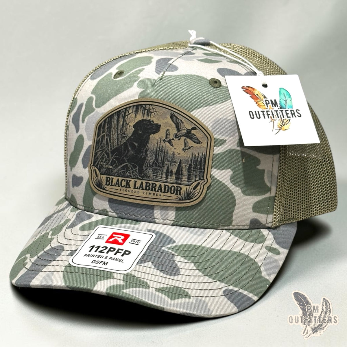 Black Labrador flooded timber leather patch hat on Richardson 112PFP Marsh camo – angled front view