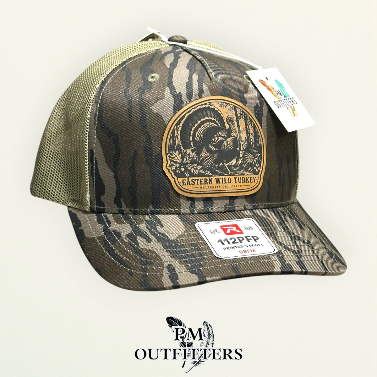 Eastern Wild Turkey leather patch Mossy Oak Bottomland trucker hat – left angle