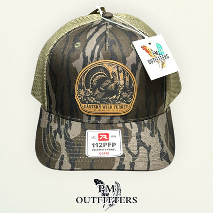 Eastern Wild Turkey hunting leather patch Richardson 112PFP Mossy Oak Bottomland camo hat – front view